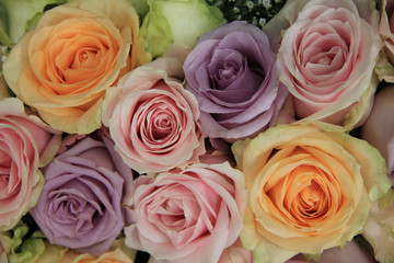 Pastel roses in bridal arrangement
