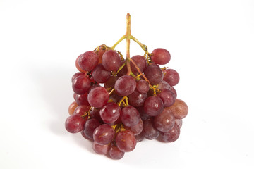 red grapes over white background.