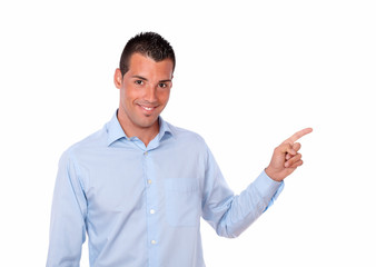 Attractive hispanic man pointing to his left