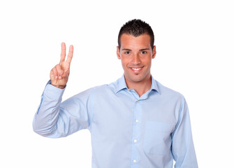 Fototapeta premium Cute young man with victory sign