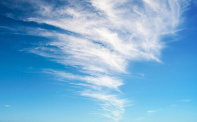 Blue sky with windy clouds. Background photo texture