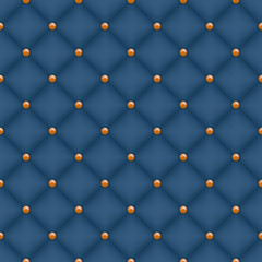 Seamless dark blue quilted background with golden pins.