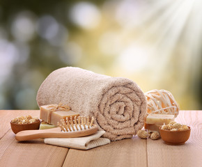 Outdoor spa setting with rolled towel and bath toiletries
