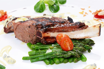 rack of lamb on grill with an asparagus