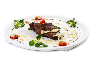 rack of lamb on grill with an asparagus