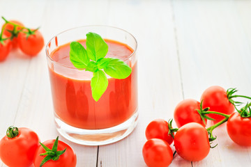 Fresh tomato juice wooden background