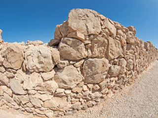 Fototapeta na wymiar Wall of Herods castle in fortress Masada, Israel