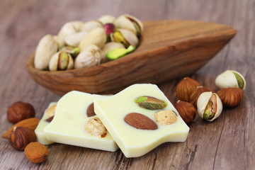 White chocolate pieces with almonds, pistachios and hazelnuts