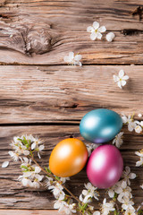 Easter colored eggs on wood
