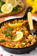 Vegan paella with corn and green peas