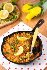Vegan paella with corn and green peas