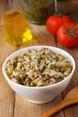 Cooked mung beans with rice on wooden background