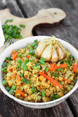 Asian vegetarian bulgur pilaf with chickpeas, carrots and garlic