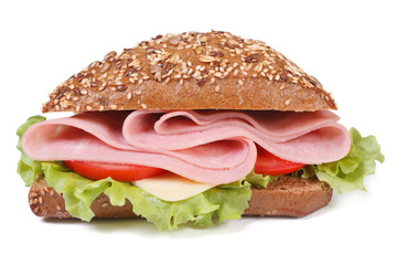 Fototapeta sandwich with ham, cheese, tomatoes and lettuce isolated obraz