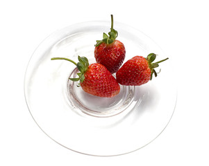 Fresh strawberries on glass plate