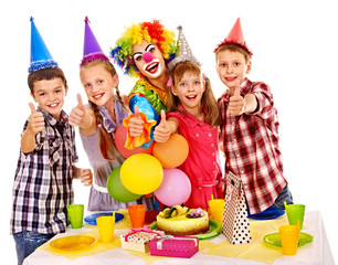 Birthday party group of child with cake.