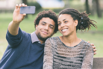 Naklejka premium Mixed-Race Couple Taking Selfie