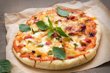 Pizza with tomato sauce and basil