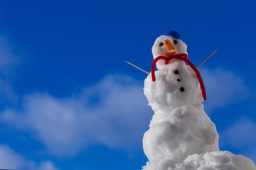 Little happy snowman with toothpick outdoor. Winter season.
