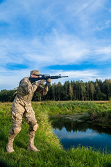 Fototapeta premium Soldier with a rifle