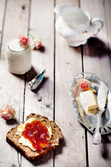 Bread with butter, jam and yogurt