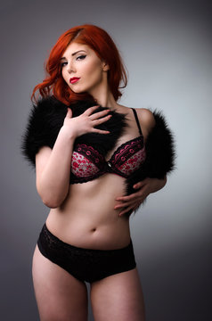Confident curvy woman posing in lingerie