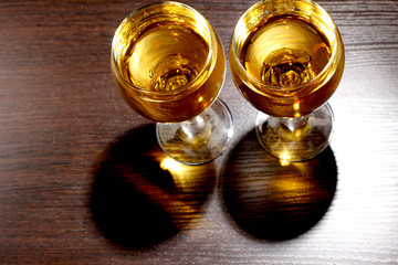 Obraz na płótnie Canvas Whiskey glass on wood