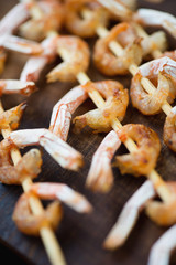 Vertical shot of grilled shrimps, close-up