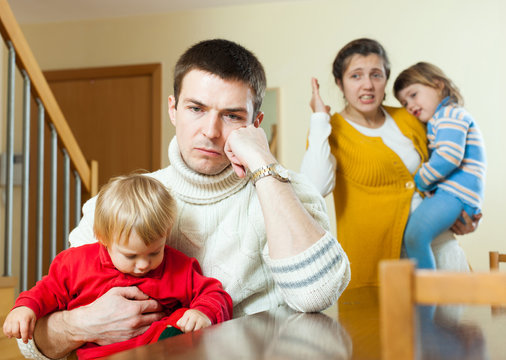 Family of four having quarrel at home
