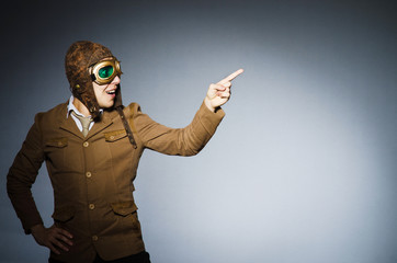 Funny pilot with goggles and helmet
