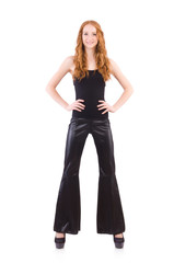 Redhead woman in black bell bottom pants on white