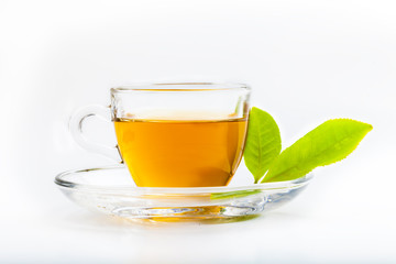 Green tea leaf and glass cup of black tea isolated on white back