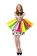 Young woman with shopping bags on white