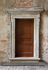 Fototapeta na wymiar old wood made doors on abandoned background