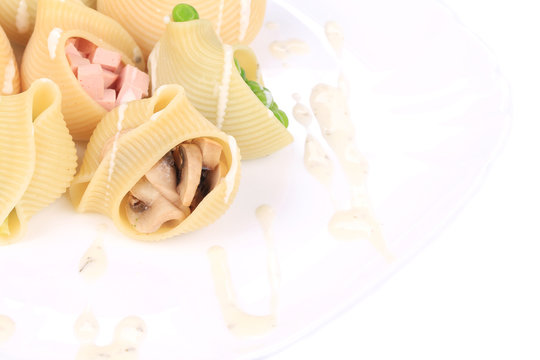pasta shells stuffed with vegetables and sausage
