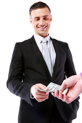 Businessman giving money isolated on white background