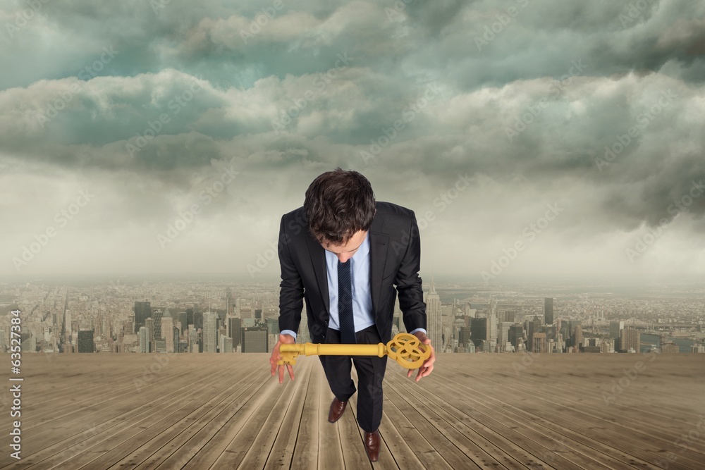 Poster composite image of businessman carrying large key