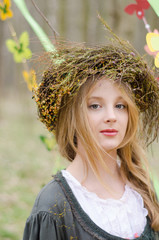 Close up portrait of a pretty pensive girl in a folk   circlet o
