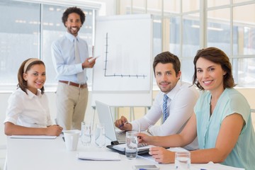 Fototapeta premium Businessman giving presentation to colleagues in office