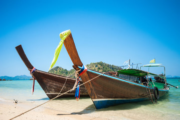 Long tailboats by the shore at Phak Bia Island, Krabi Thailand a