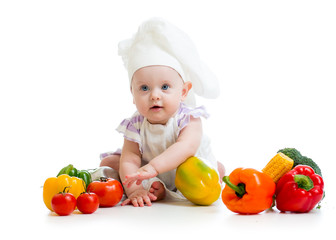baby chef with healthy  food vegetables