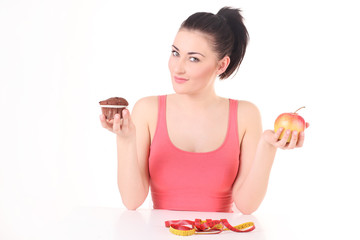 Beautiful woman with doughnuts and apple. - obrazy, fototapety, plakaty