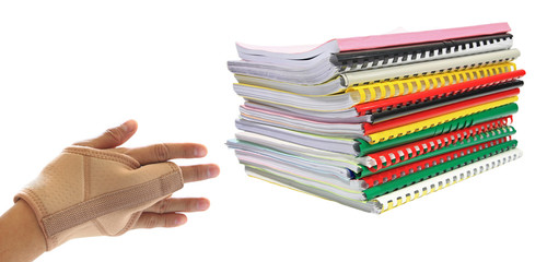 Stack of books with hand pain isolated
