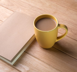 coffee cup with notebooks.