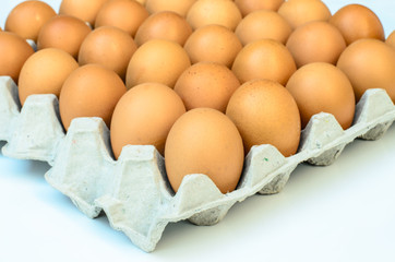 the brown eggs in egg box