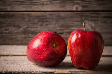 red apples on wooden background