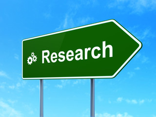 Advertising concept: Research and Gears on road sign background
