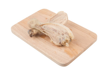 Place the cooked chicken on a wooden cutting board.