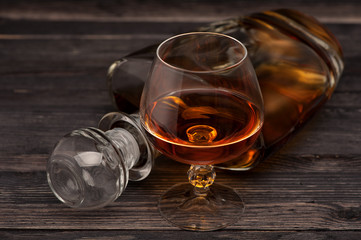 Cognac on  wooden background