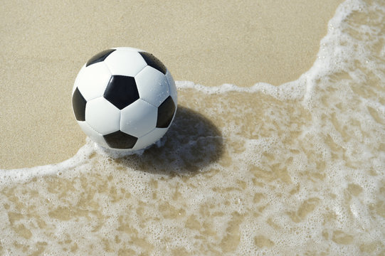 Brazilian Beach Soccer Football in the Wave